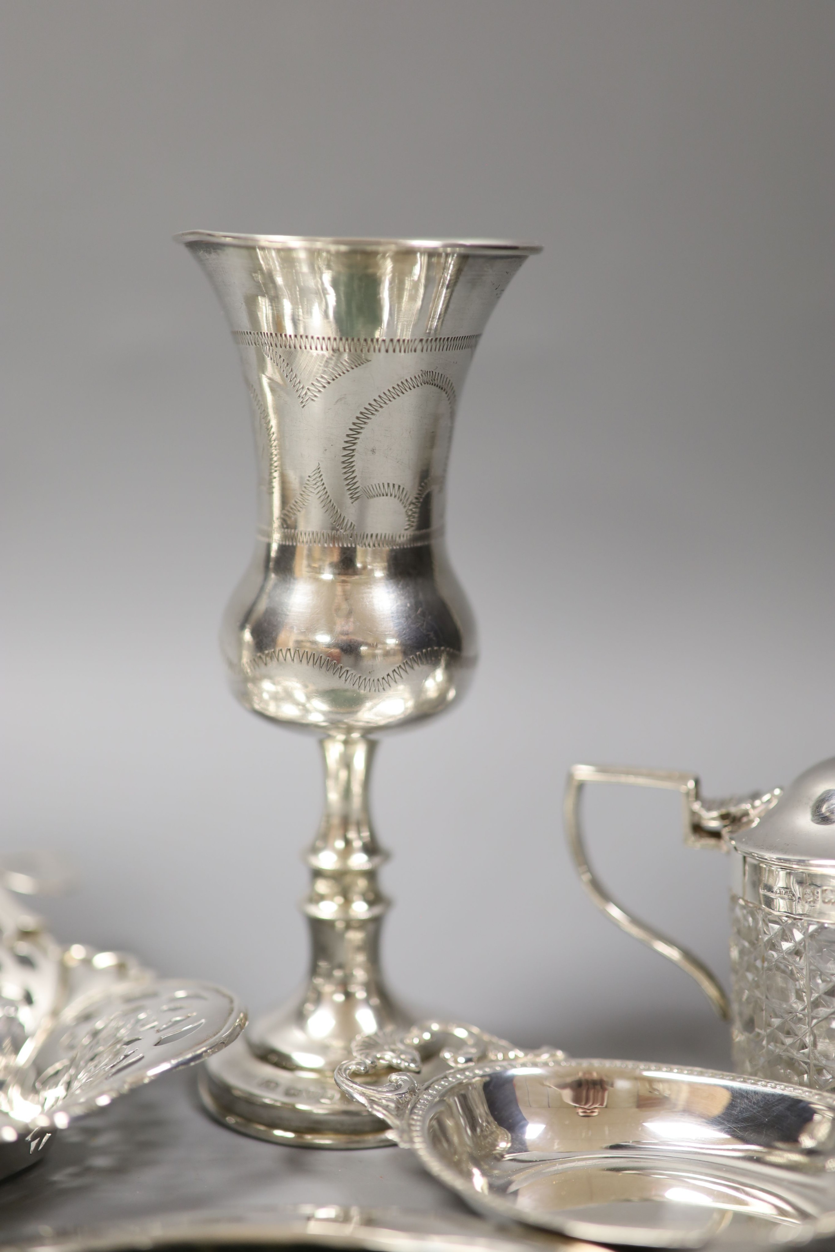 A small silver dish and other sundry silver including kiddush cup, 925 vase, miniature trays and photograph frames.